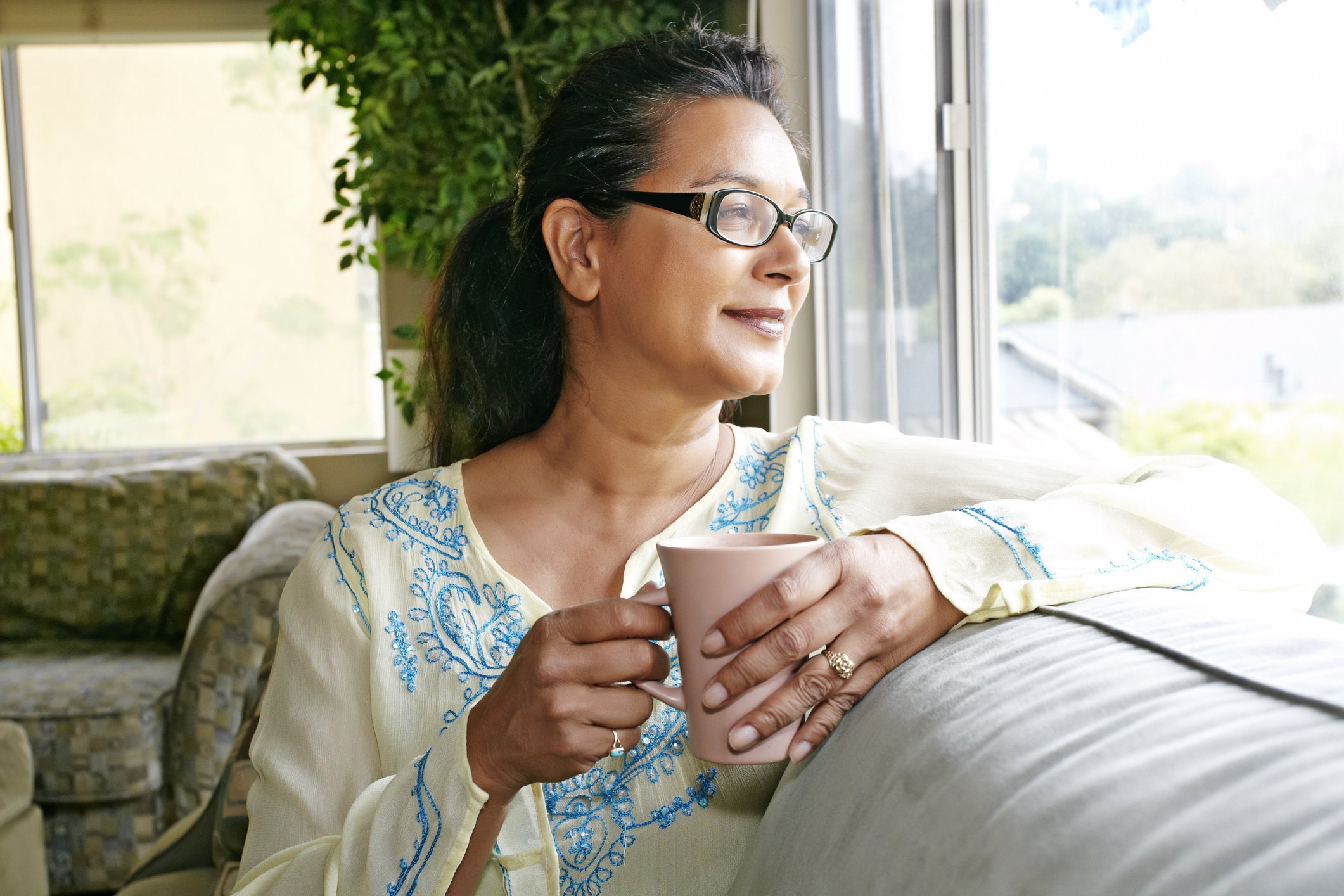 Lifestyle_Stock_Middleaged_Woman_NativeAmerican_Smiling_LivingRoom.jpg