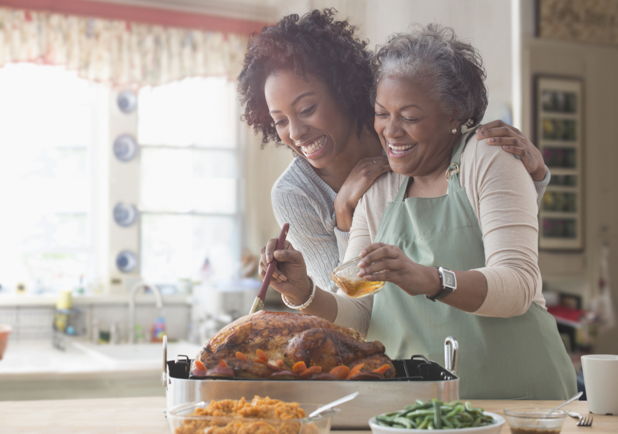 Lifestyle_Stock_Mother_Daughter_Black_Cooking_Kitchen.jpg