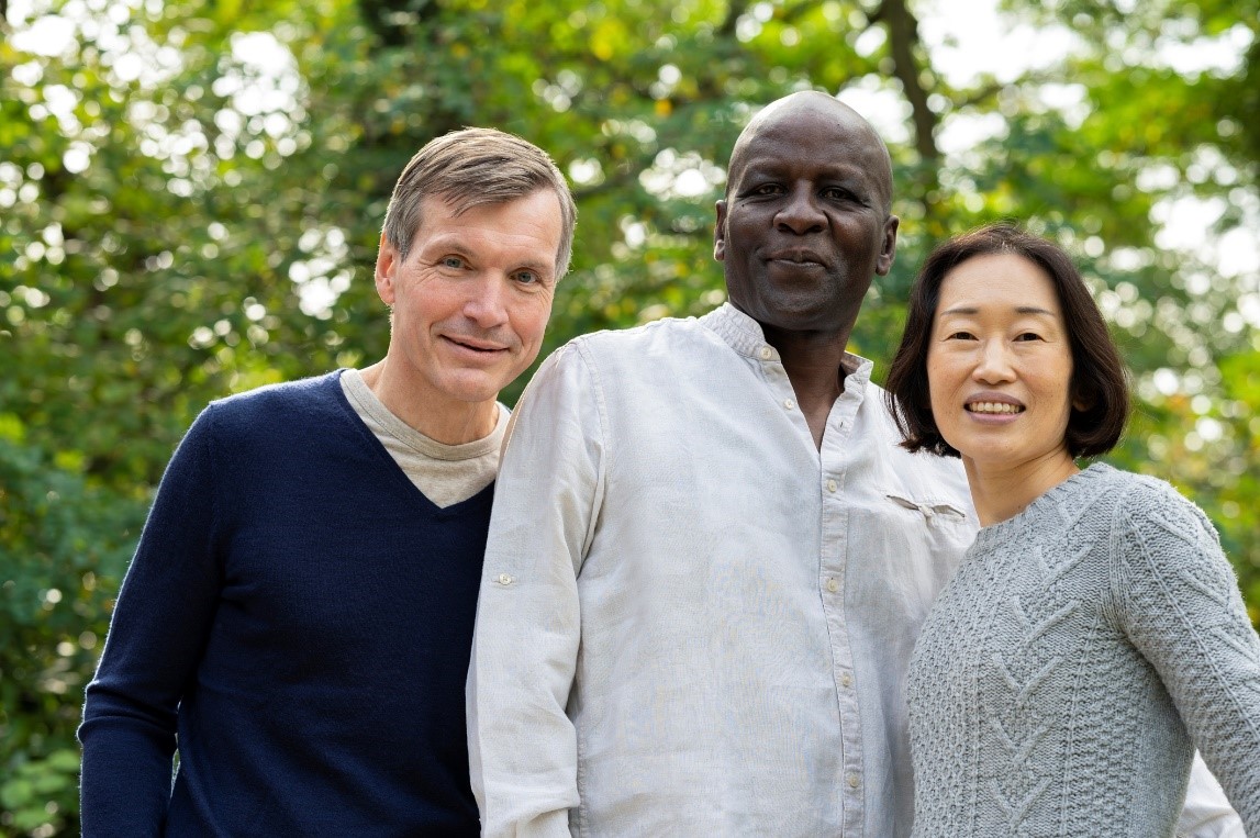 A group of people posing for a photo

Description automatically generated